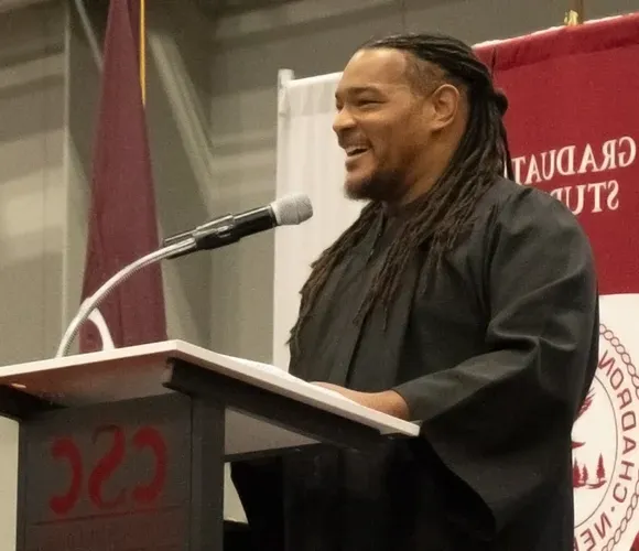 Man speaking at a lectern